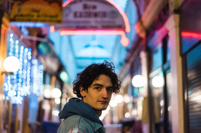 Portrait of young man in shopping centre