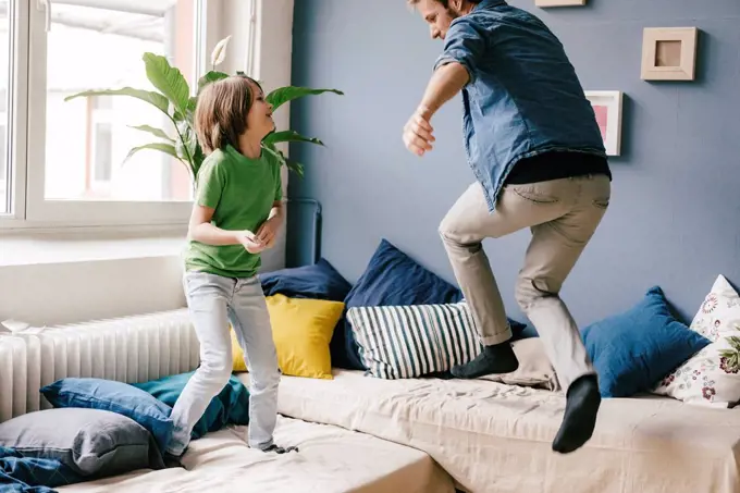 Playful father and son at home