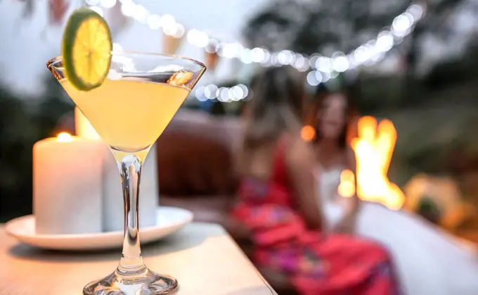 Close-up of lime cocktail ready to drink at an outdoor party