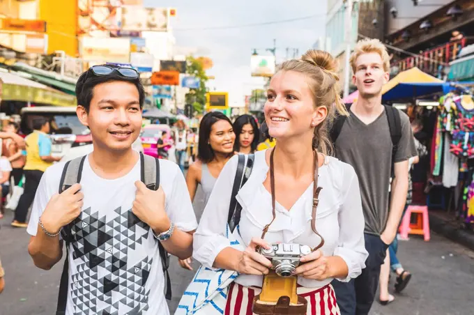 Thailand, Bangkok, Khao San Road, portrait of friends exploring the city