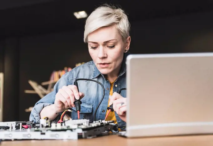 Woman working on computer equipment