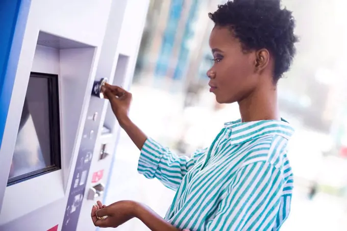 Woman at ticket machine