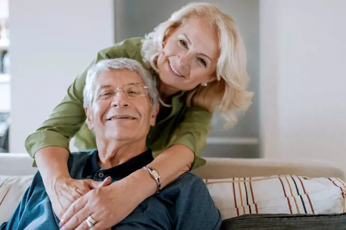 Portrait of affectionate senior couple at home