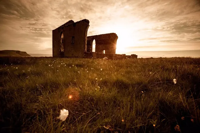 UK, Scotland, Isle of Skye, ruin of a church at sunset