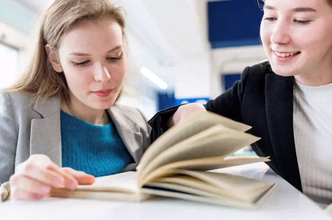 Portrait of teenage girls in a public library