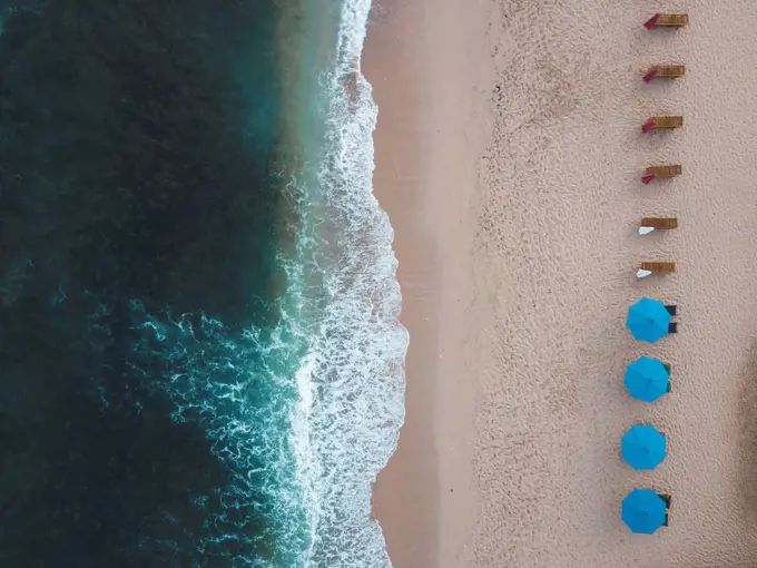 Indonesia, Bali, Aerial view of Balangan beach, empty sun loungers