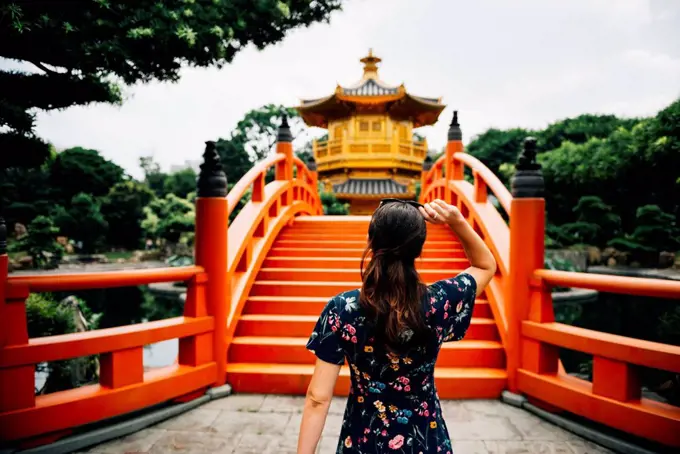 China, Hong Kong, Diamond Hill, Nan Lian Garden, Female tourist lookint at Golden Pavilion of Absolute Perfection