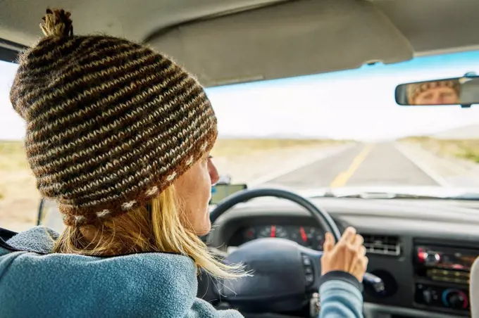 Peru, Arequipa, woman driving car on Panamericana