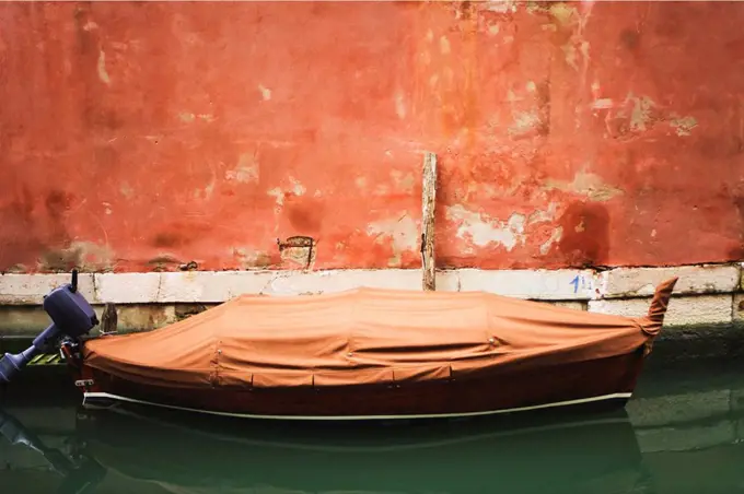 Italy, Venice, Boat anchoring in canal