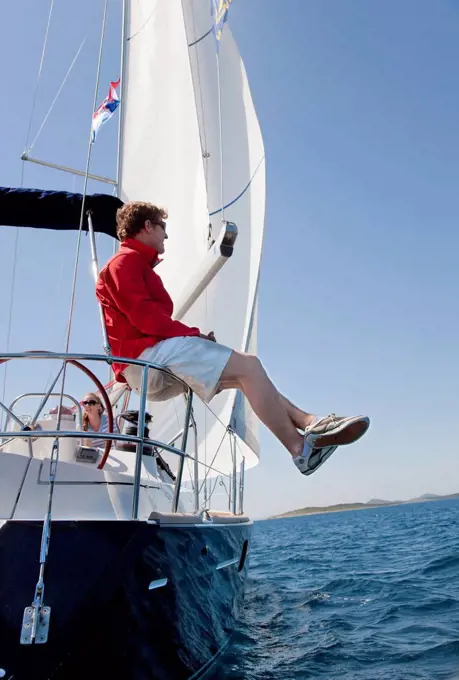 Croatia, Zadar, Man and woman travelling in sail boat