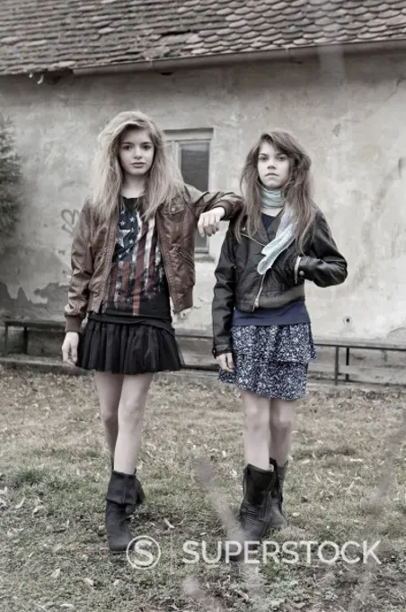 Germany, Bavaria, Two girls walking on backstreet