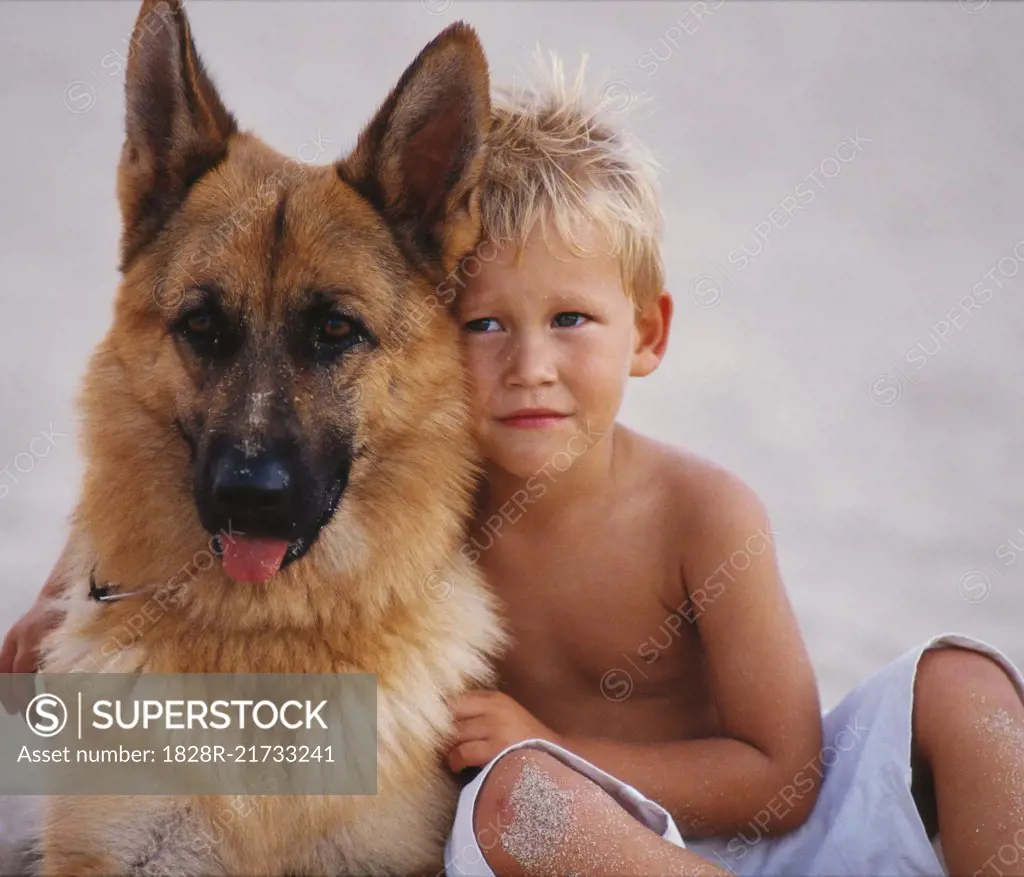 Portrait of Boy Hugging Dog   