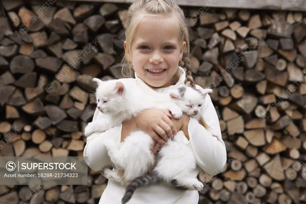 Girl Holding Kittens   