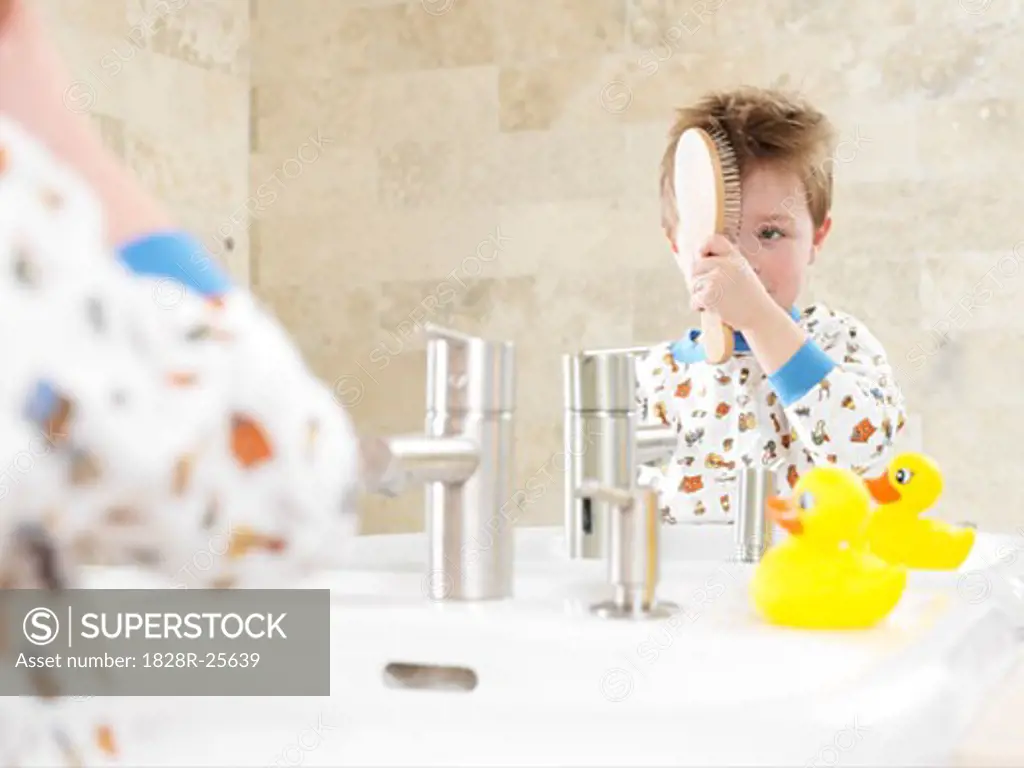 Little Boy Brushing Hair   