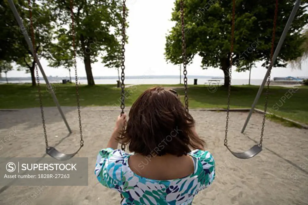 Woman Sitting on Swing   