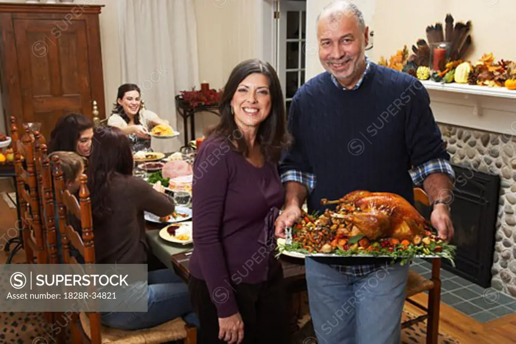 Couple with Thanksgiving Turkey  