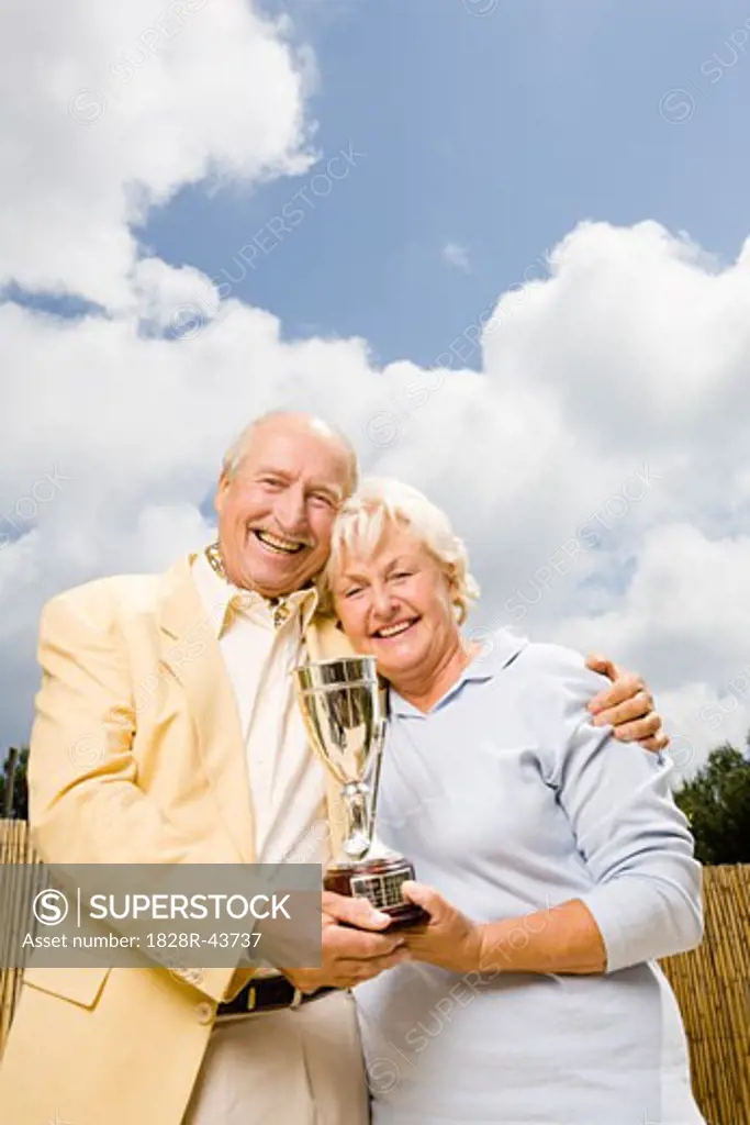 Couple Holding Trophy   