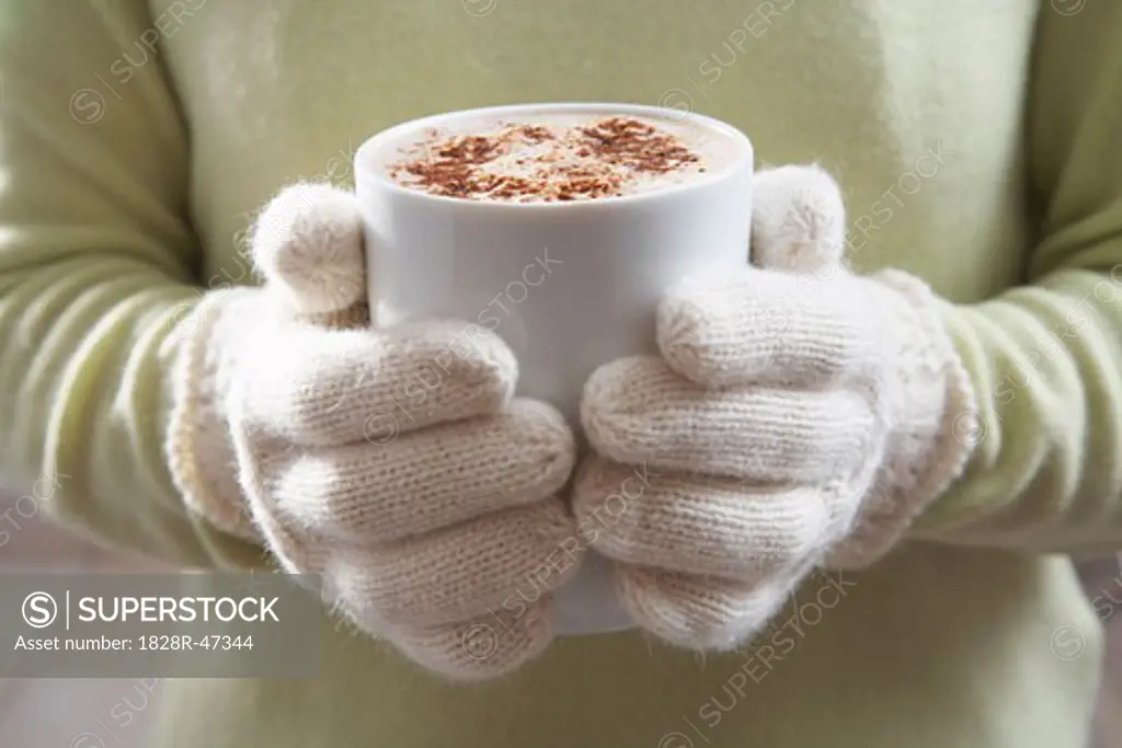 Close-up of Woman Holding Mug of Hot Chocolate   