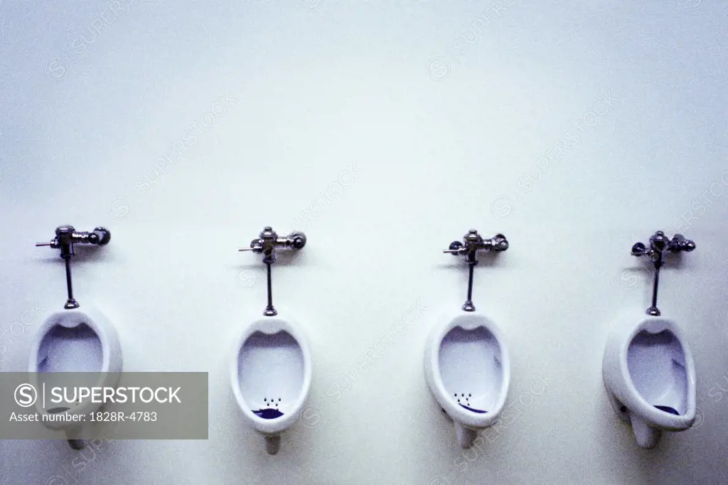 Row of Urinals in Bathroom   