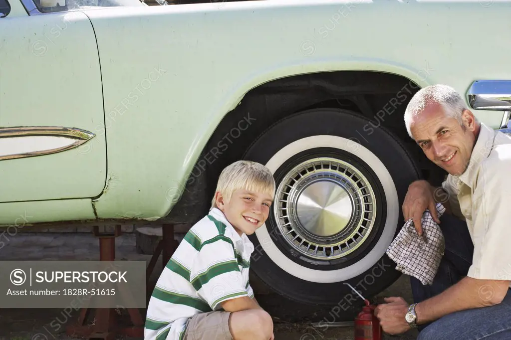 Portrait of Family Fixing Car   