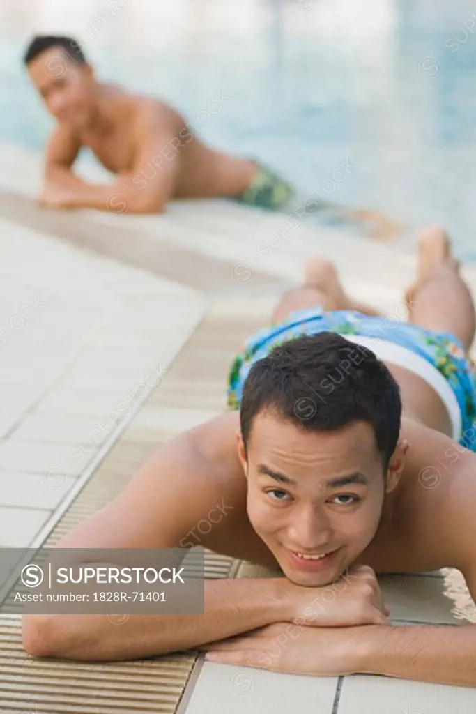 Man Lying Pool Side