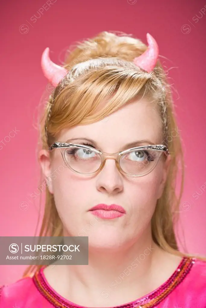 Portrait of Woman Wearing Devil Horns and Vintage Eyeglasses