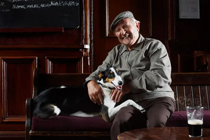 Man With Dog in Pub   