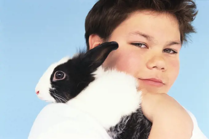 Portrait of Boy with Pet Rabbit   