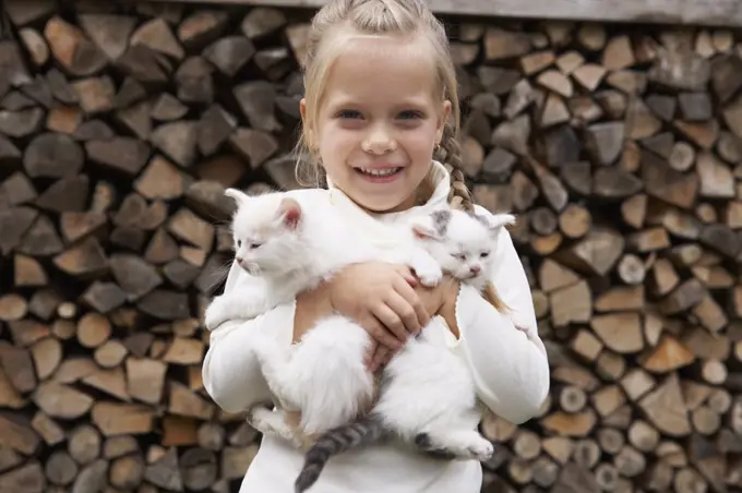 Girl Holding Kittens   