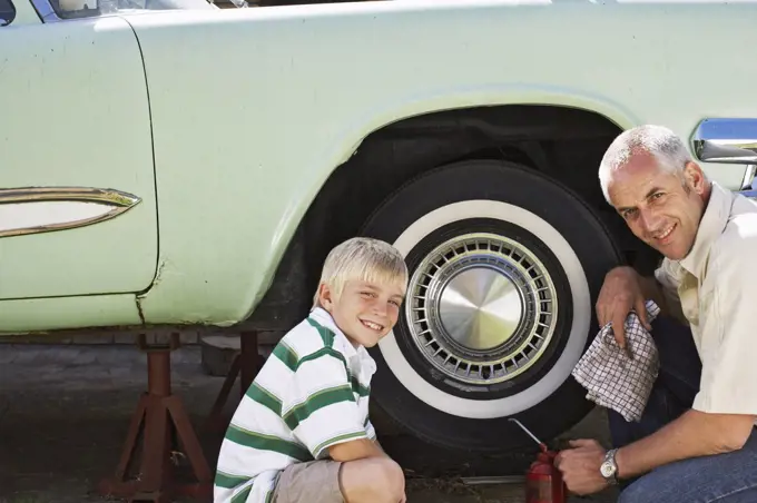 Portrait of Family Fixing Car   