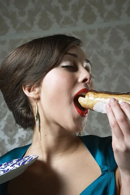 Woman Eating Eclair   