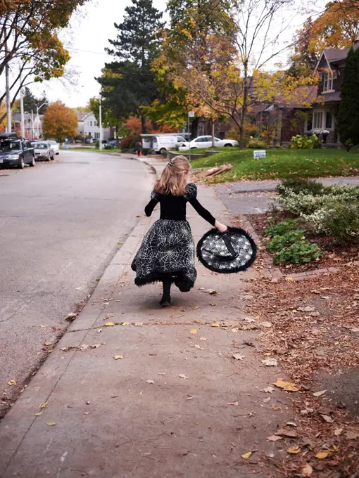 Girl Trick or Treating in Witch Costume, Toronto, Ontario, Canada. 10/31/2011