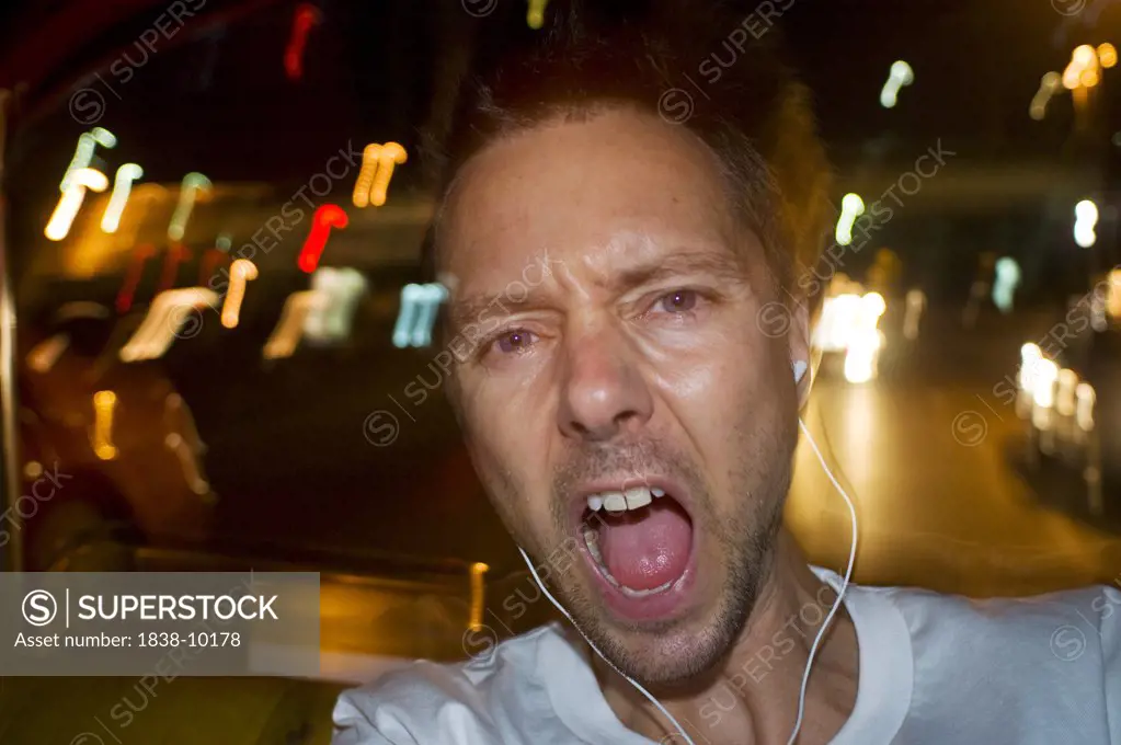 Man with Earphones Yelling