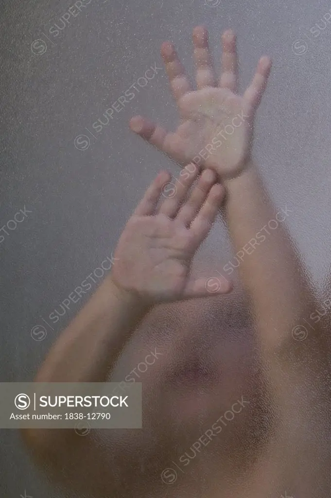 Child's Hands Pressed Against Shower Glass