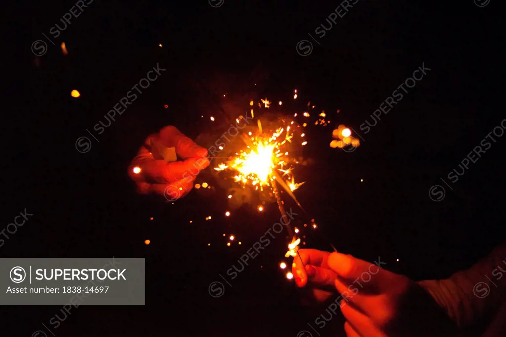 Hands Holding Sparklers