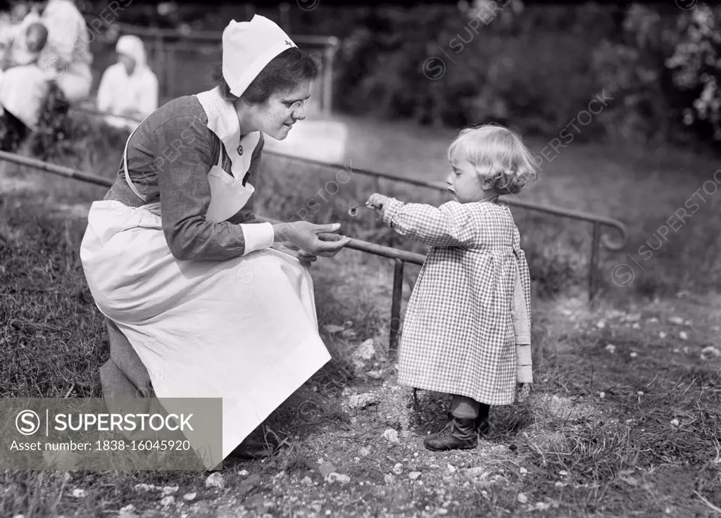 Young French Girl giving Flower to Nurse at American Red Cross Nursing Home, near Paris, France, Lewis Wickes Hine, American National Red Cross Photograph Collection