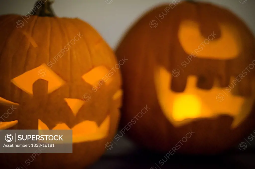 Two Carved Pumpkin Halloween Jack-O-Lanterns