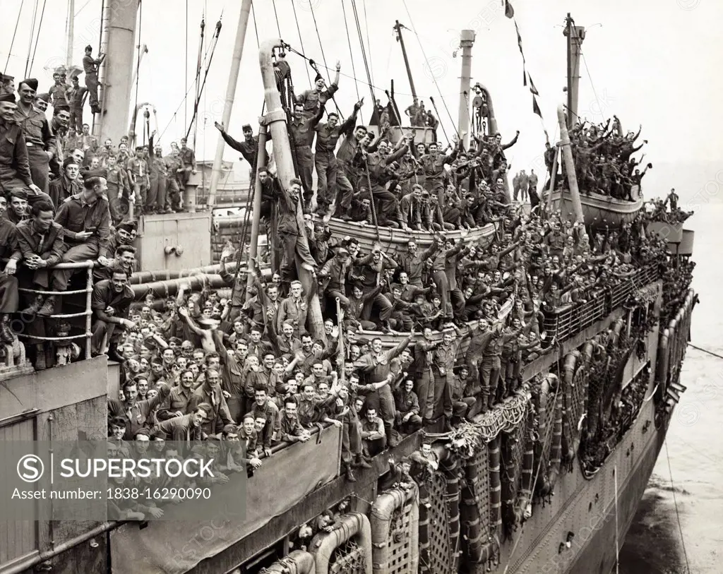 American Soldiers from 20th Armored Division and units of 9th Army, celebrate on SS John  Ericsson as they return home, Pier 87, North (Hudson) River, New York City, New York, USA, photo by Al Ravenna, World Telegram & Sun, August 6, 1945