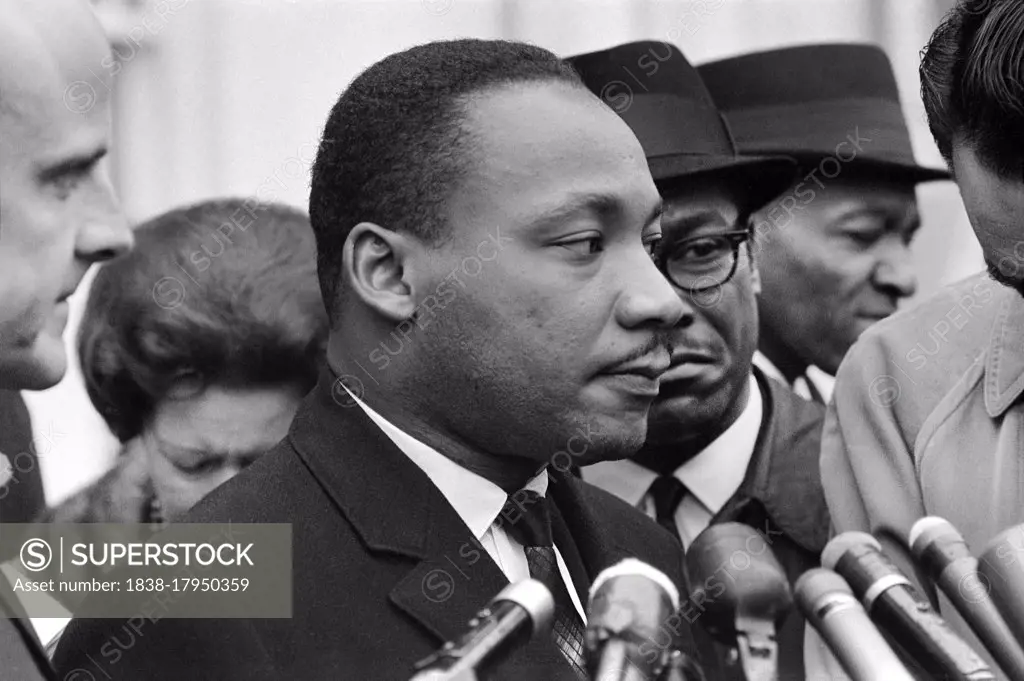 Martin Luther King, Jr., at Microphones, after meeting with President Lyndon Johnson to discuss Civil Rights, at White House, Washington, D.C. USA, Warren K. Leffler, December 3, 1963