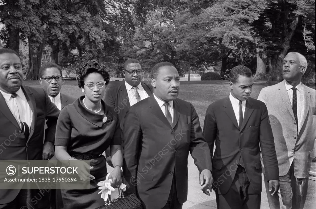 Ralph Abernathy (left), Martin Luther King, Jr. (center), John Lewis (2nd right) with group of people leaving White House after meeting with U.S. President Lyndon Johnson, Washington, D.C., USA, Marion S. Trikosko, August 5, 1965