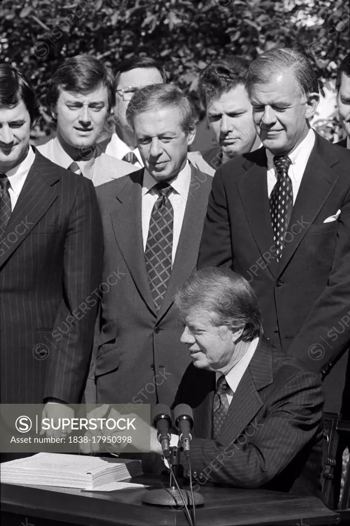 U.S. President Jimmy Carter signing Food and Agriculture Act of 1977, Rose Garden, White House, Washington, D.C., USA, Marion S. Trikosko, September 29, 1977