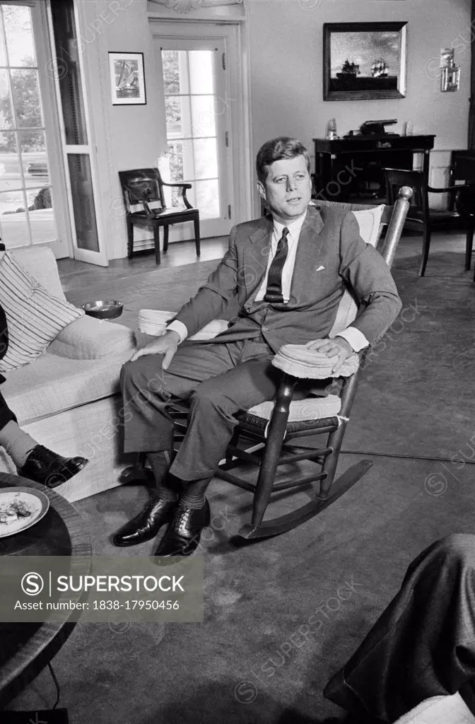 U.S. President John Kennedy, seated portrait in Rocking Chair, White House, Washington, D.C., USA, Warren K. Leffler, October 24, 1962