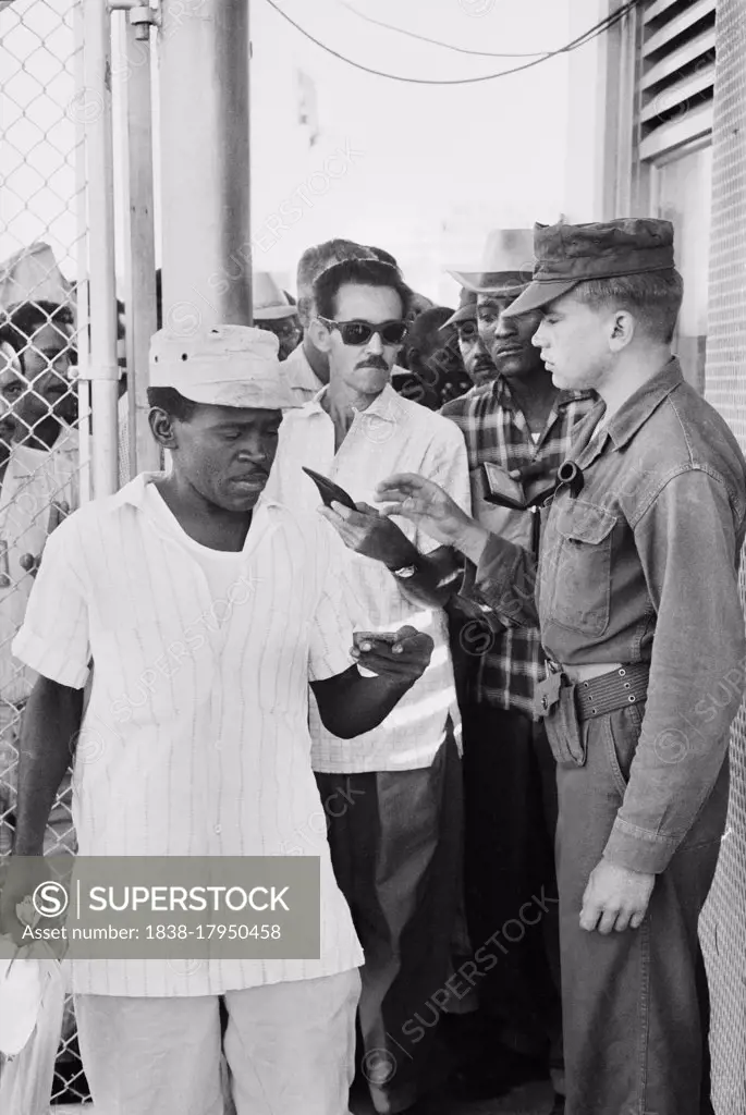 Cuban Workers exiting for the day, Guantanamo Bay U.S. Naval Base, Cuba, Warren K. Leffler, November 12, 1962