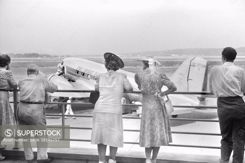 Visitors watching Airplane from Observation Platform, Municipal Airport, Washington, D.C., USA, Jack Delano, U.S. Office of War Information, July 1941