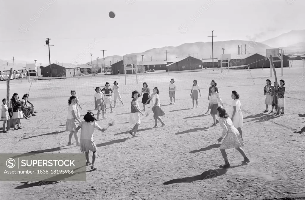 Japanese-American Girls playing Volleyball, Manzanar Relocation Center, California, USA, Ansel Adams, Manzanar War Relocation Center Collection, 1943