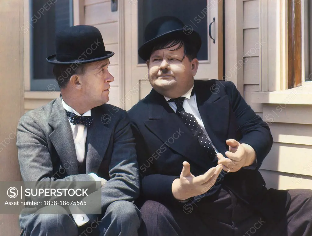 Stan Laurel (1890-1965) English Comic Actor and Oliver Hardy (1892-1957), American Comic Actor, seated Portrait, Harry Warnecke, 1938