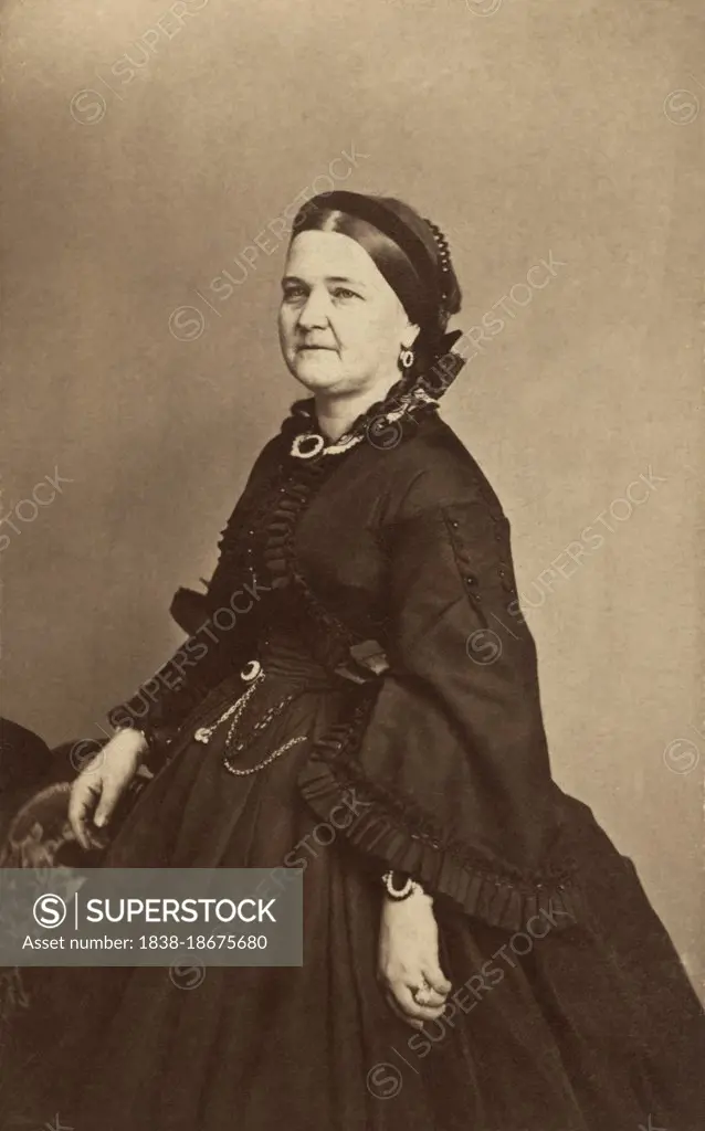 Mary Todd Lincoln (1818-1882), First Lady of the United States as wife of U.S. President Abraham Lincoln, three-quarter length portrait in black mourning dress after the death of her son, Willie, Mathew Brady Studio, 1863