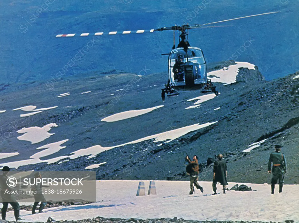 Robert Shaw (center with gun), on-set of the British Film, "Figures in a Landscape", National General Pictures, 1970