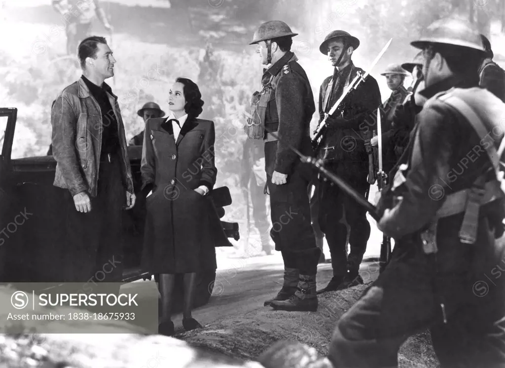 Brian Aherne (left), Merle Oberon, on-set of the Film, "First Comes Courage", Columbia Pictures, 1943