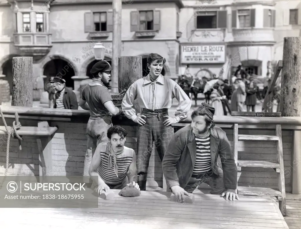 Bruce Cabot (standing, center), Andy Devine (kneeling, right), on-set of the Film, "The Flame of New Orleans, Universal Pictures, 1941